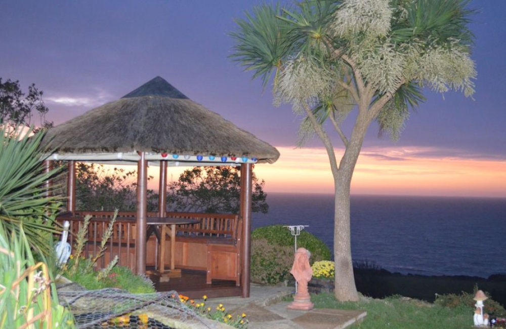 The Boat House Studio sunset view of the gazebo overlooking the sea