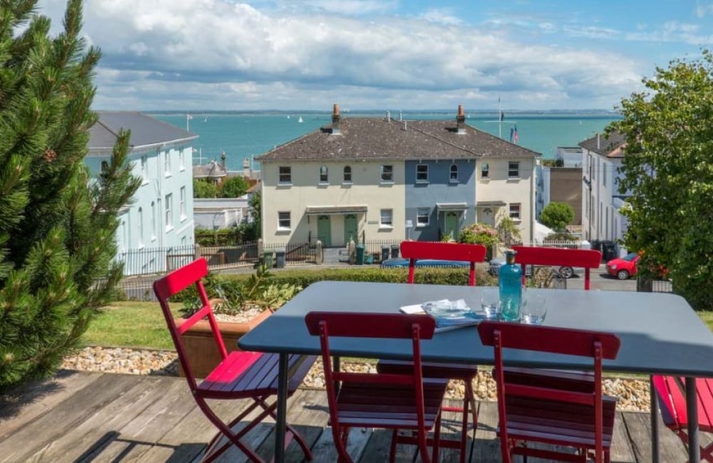 Castle Road Apartment decking with outdoor furniture and a sea view