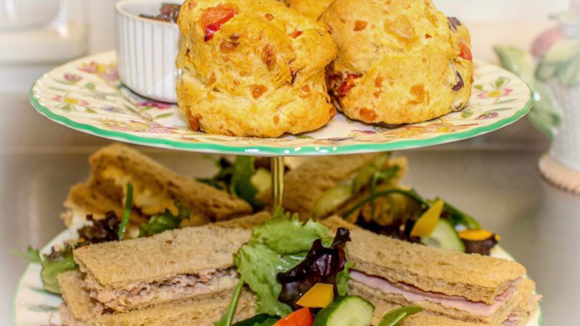 a selection of scones and finger sandwiches