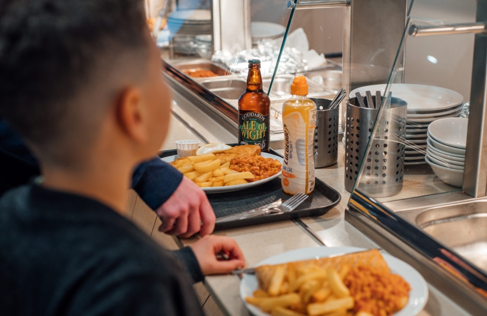 Waiting at Refuel cafe with chips and beans in the queue