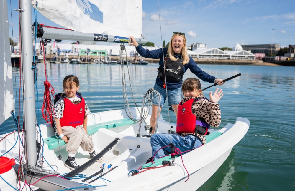 a woman and two kids on a boat 