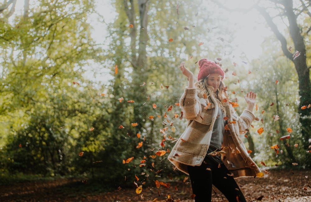 Woman spinning in the forest 