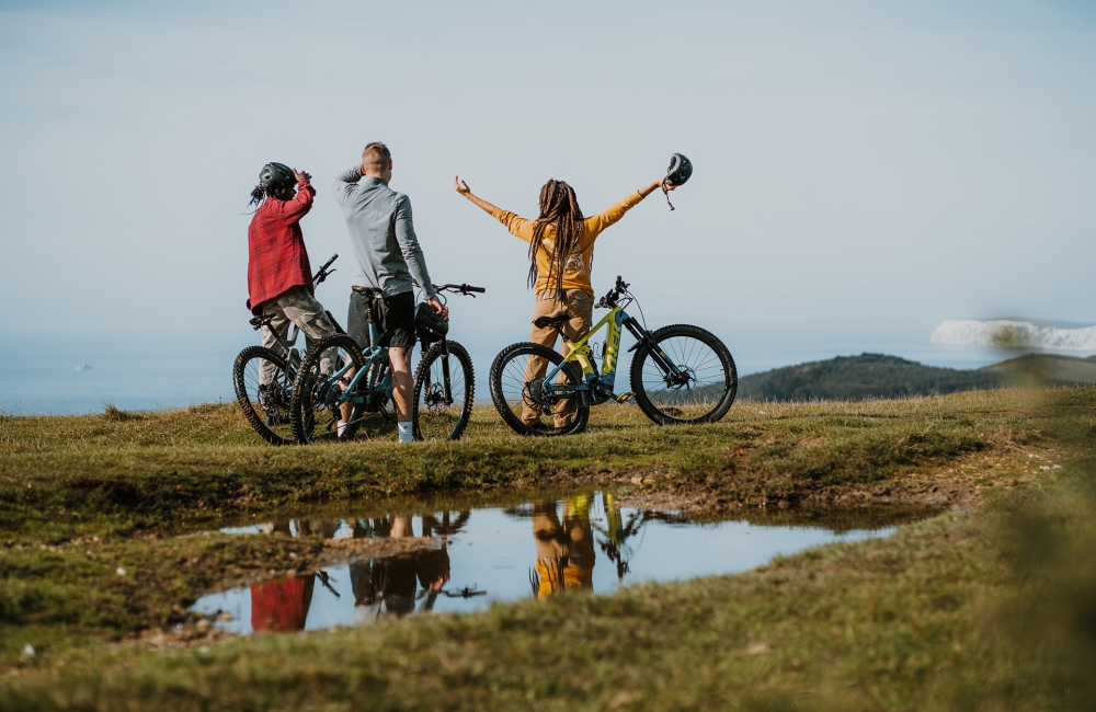 Group of friends mountain biking on a trail 