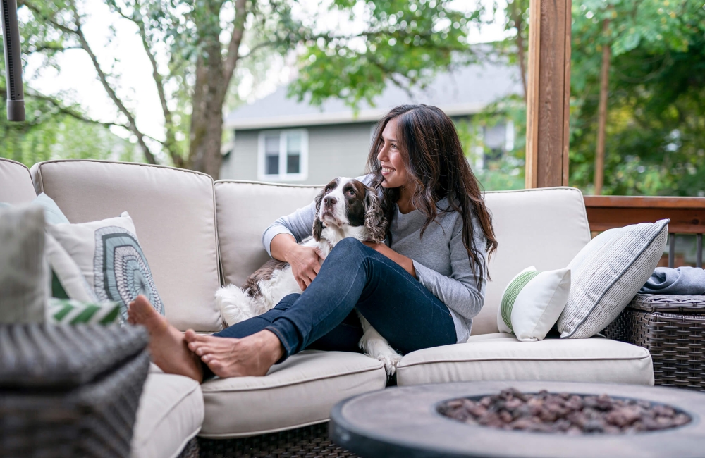 Woman and her dog on a couch 