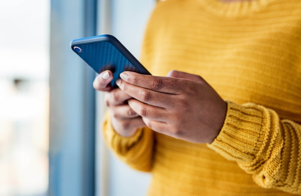 Person holding a cell phone 