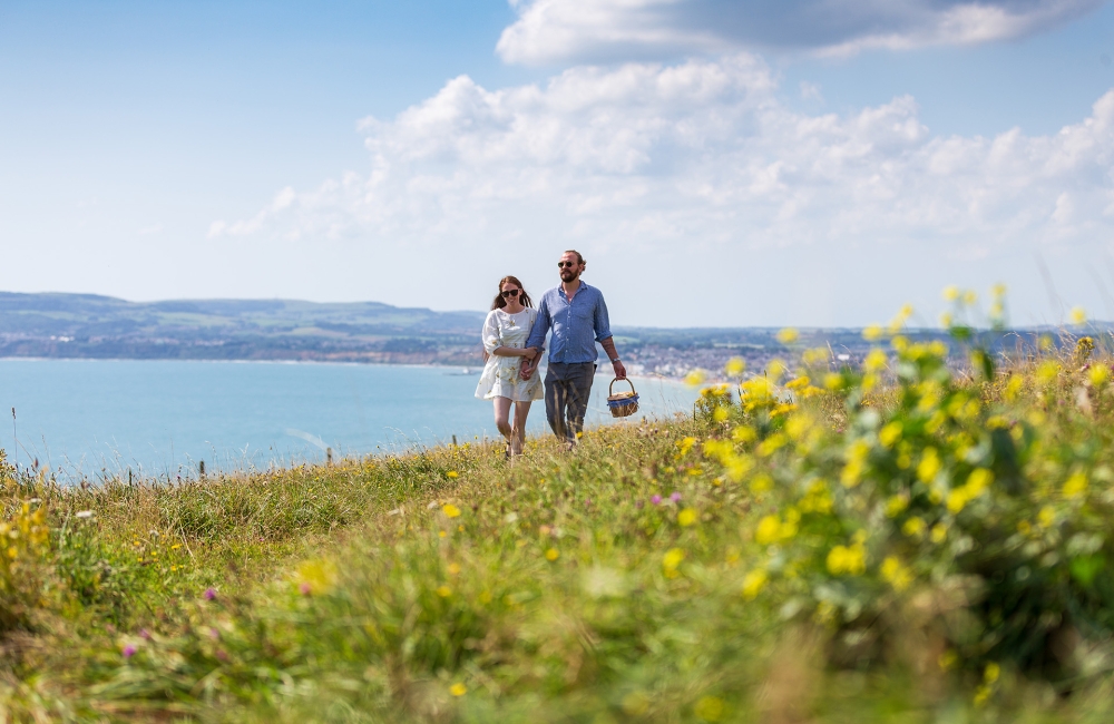 Two people walking the beach 