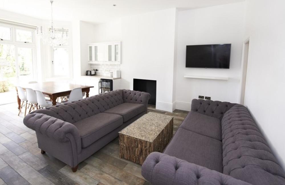 Lyon Court Garden Apartment lounge with two large sofas 