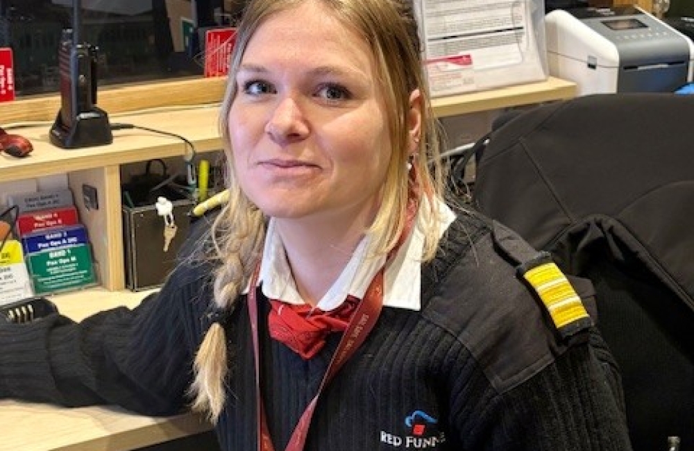 rebecca sat at her desk onboard