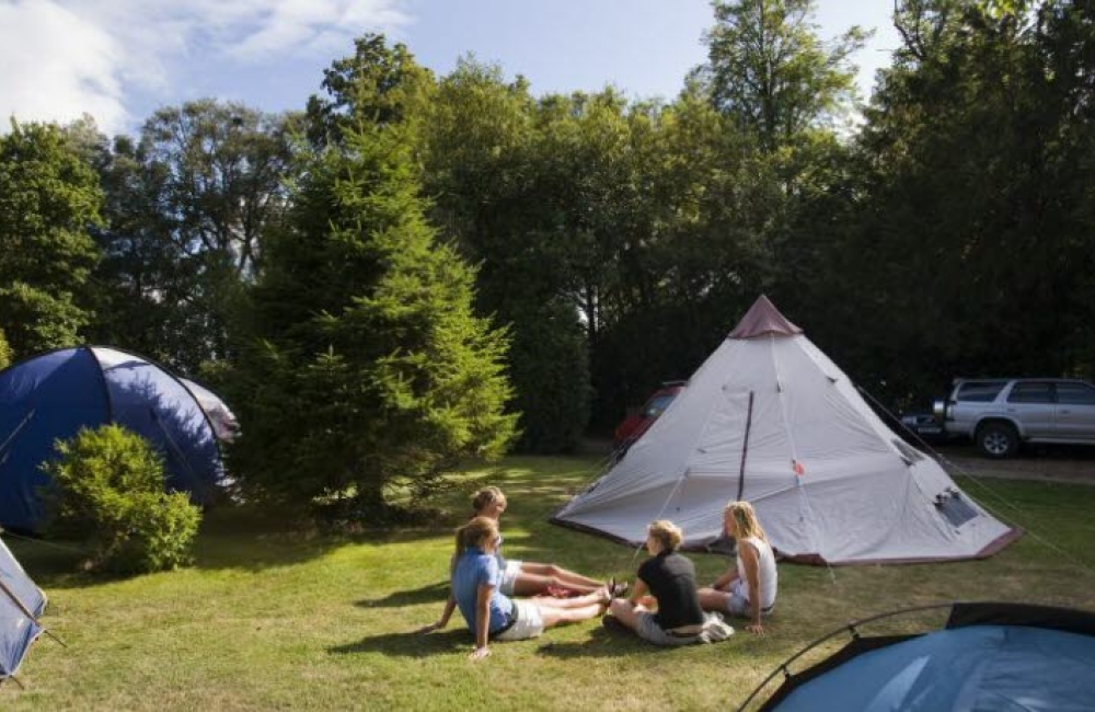 Kids hanging out at a campsite