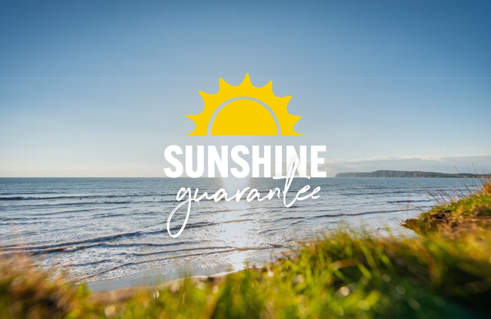 coastal photo with sunshine guarantee logo