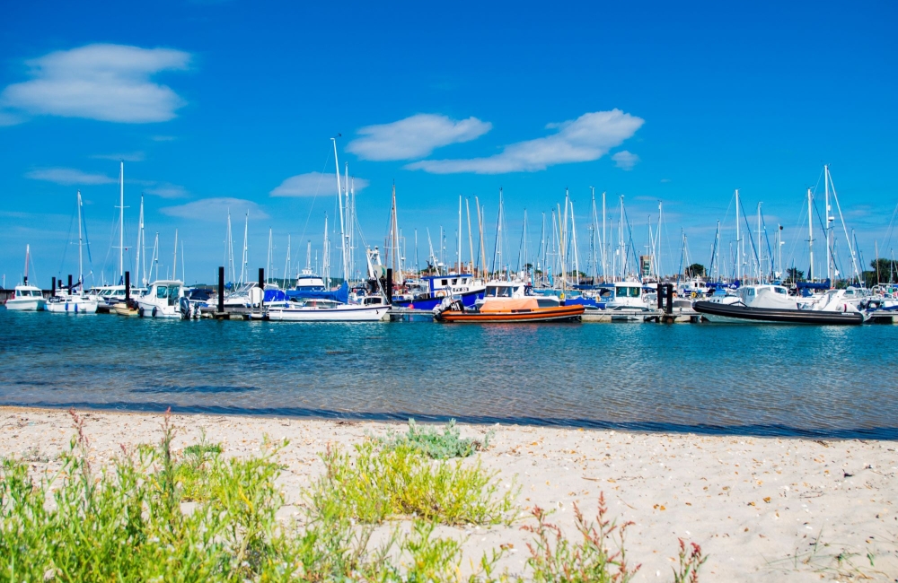 yachts in the harbour with a blue sky