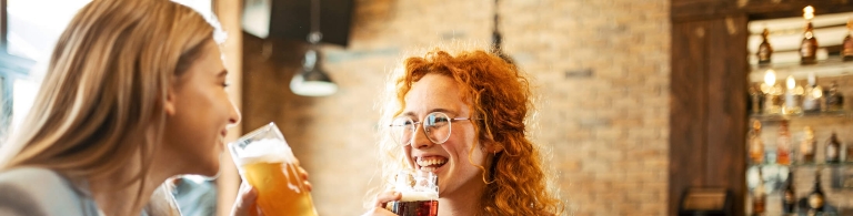 Two women drinking beer