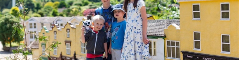 Godshill Model Village four children standing in the model village