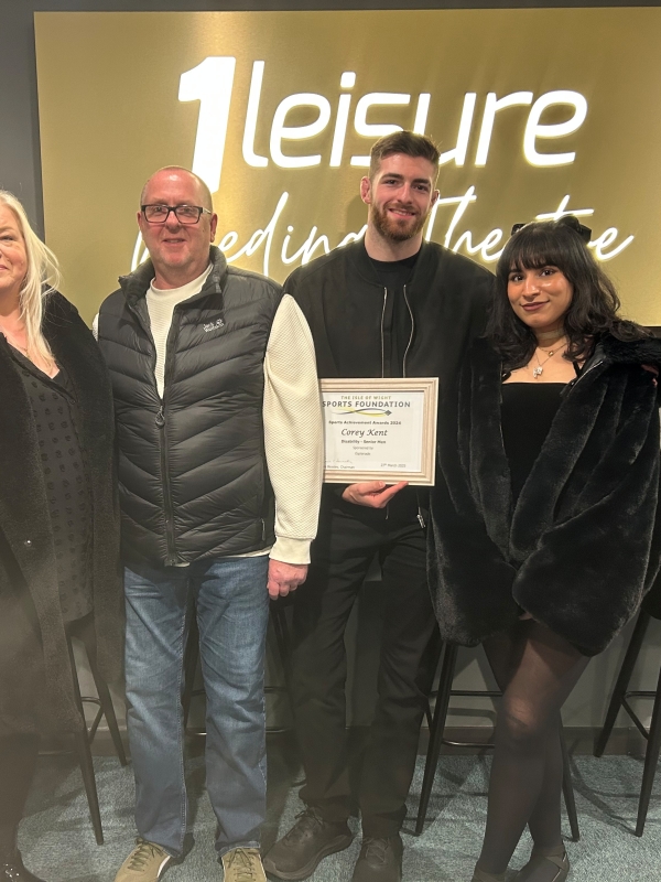 Corey with parents and girlfriend at the awards