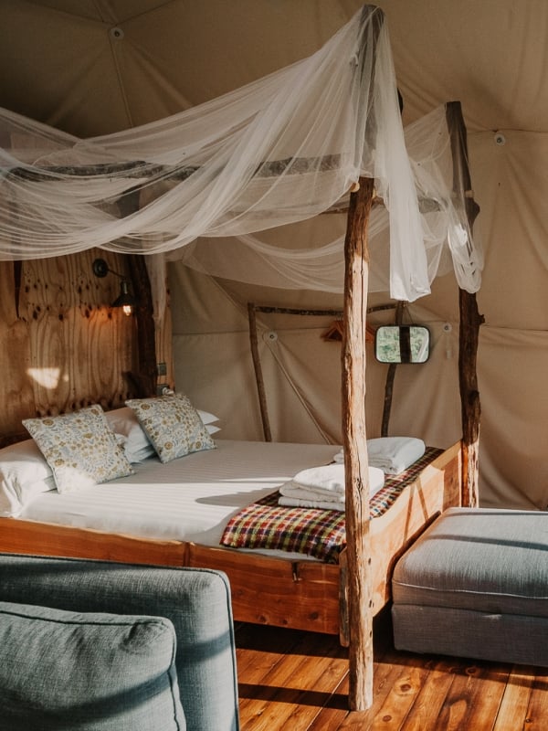 Quirky glamping space with bed and views of countryside