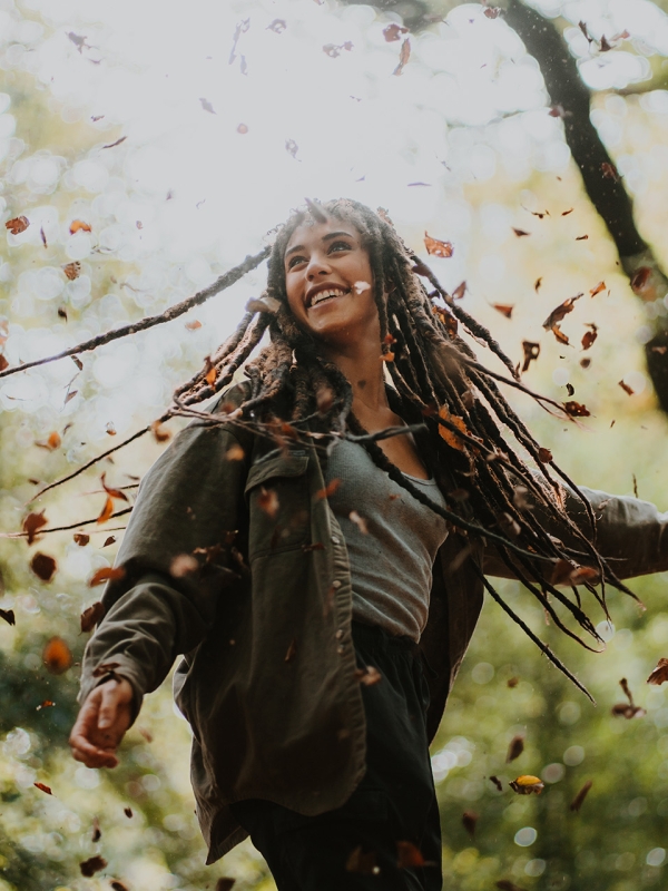 Woman spinning in the forest 