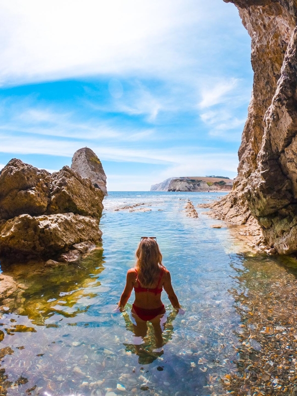 Person swimming in a cave 