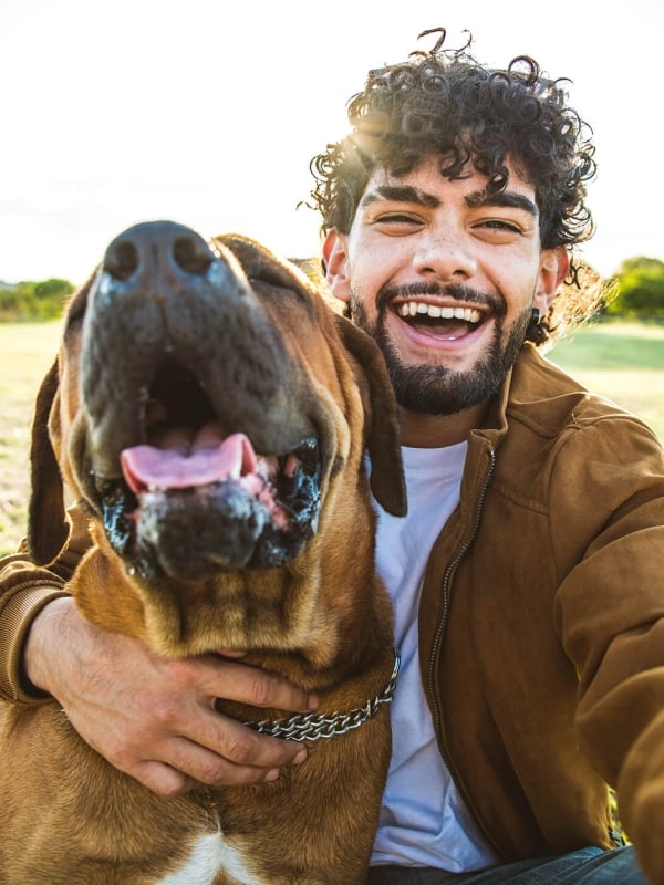Man taking a selfie with his dog