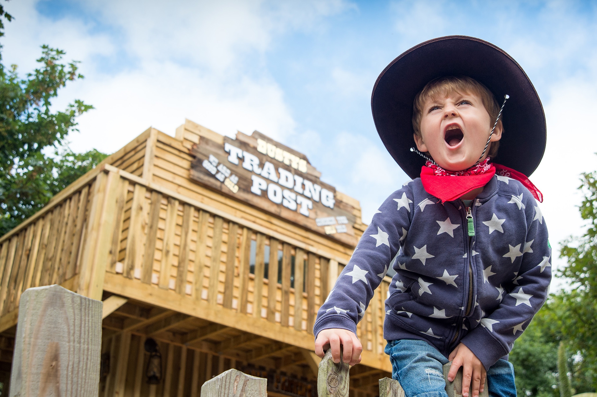 Child wearing a cowboy hat