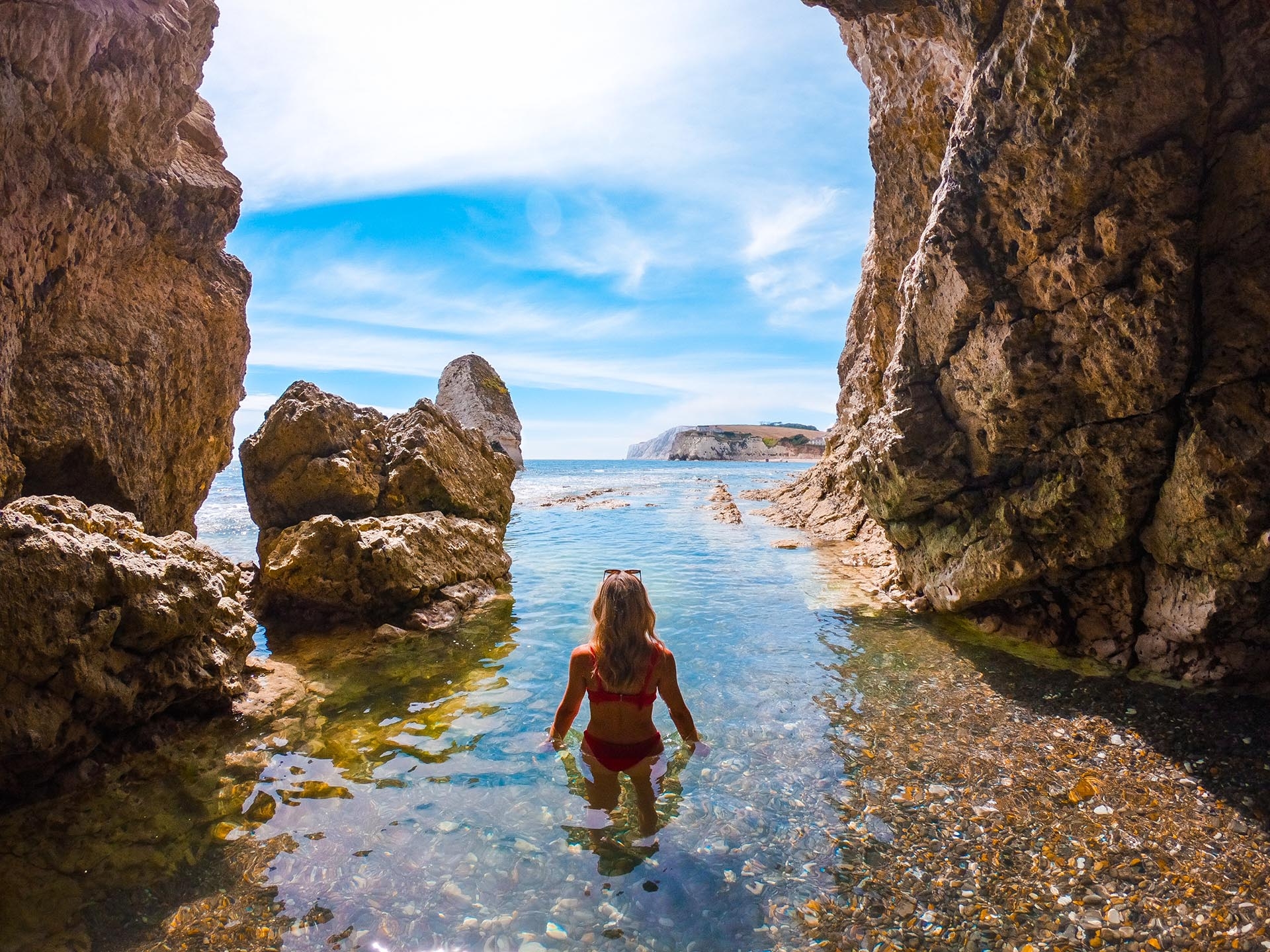 Person swimming in a cave