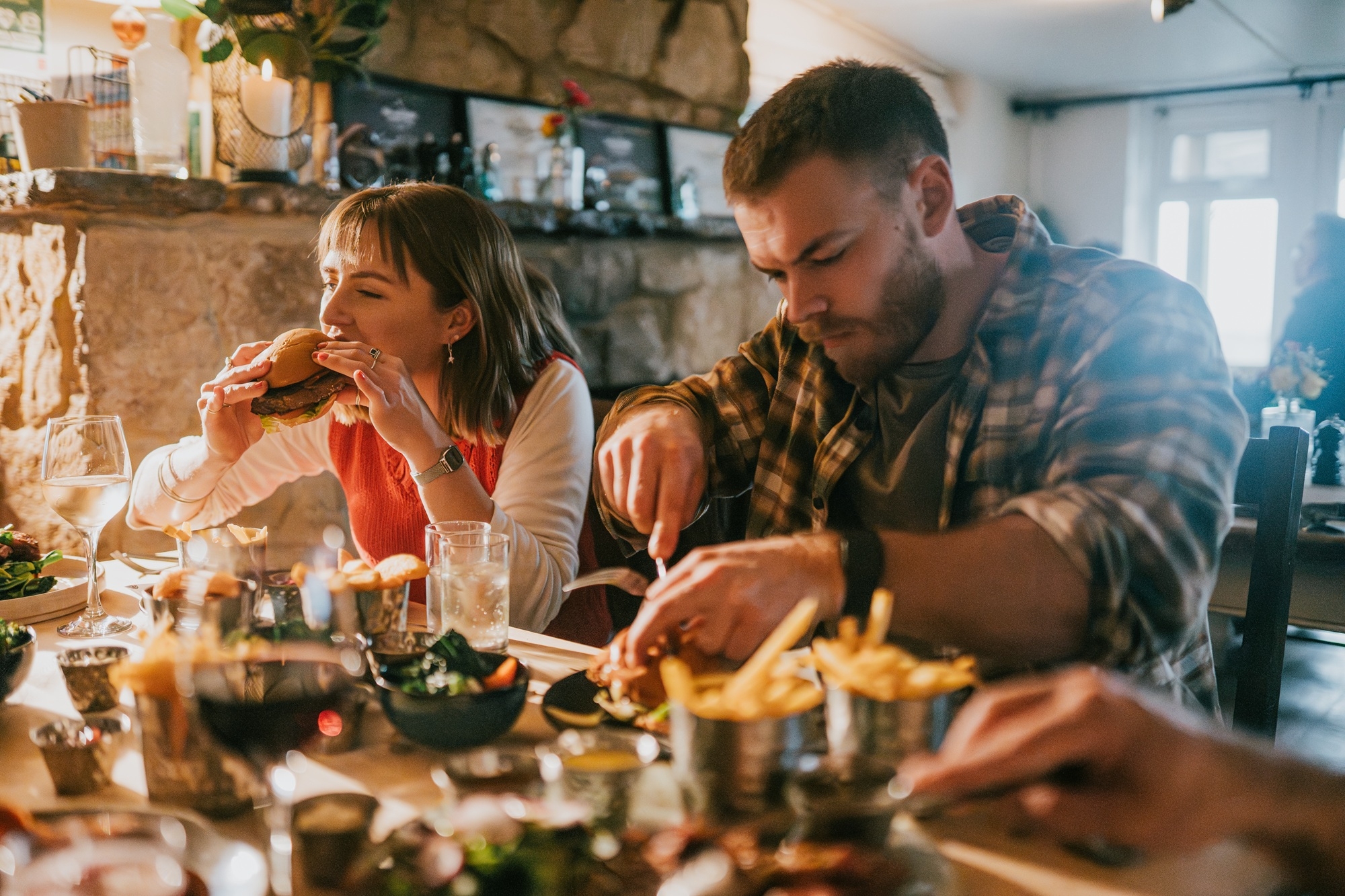 people enjoying food in a pub