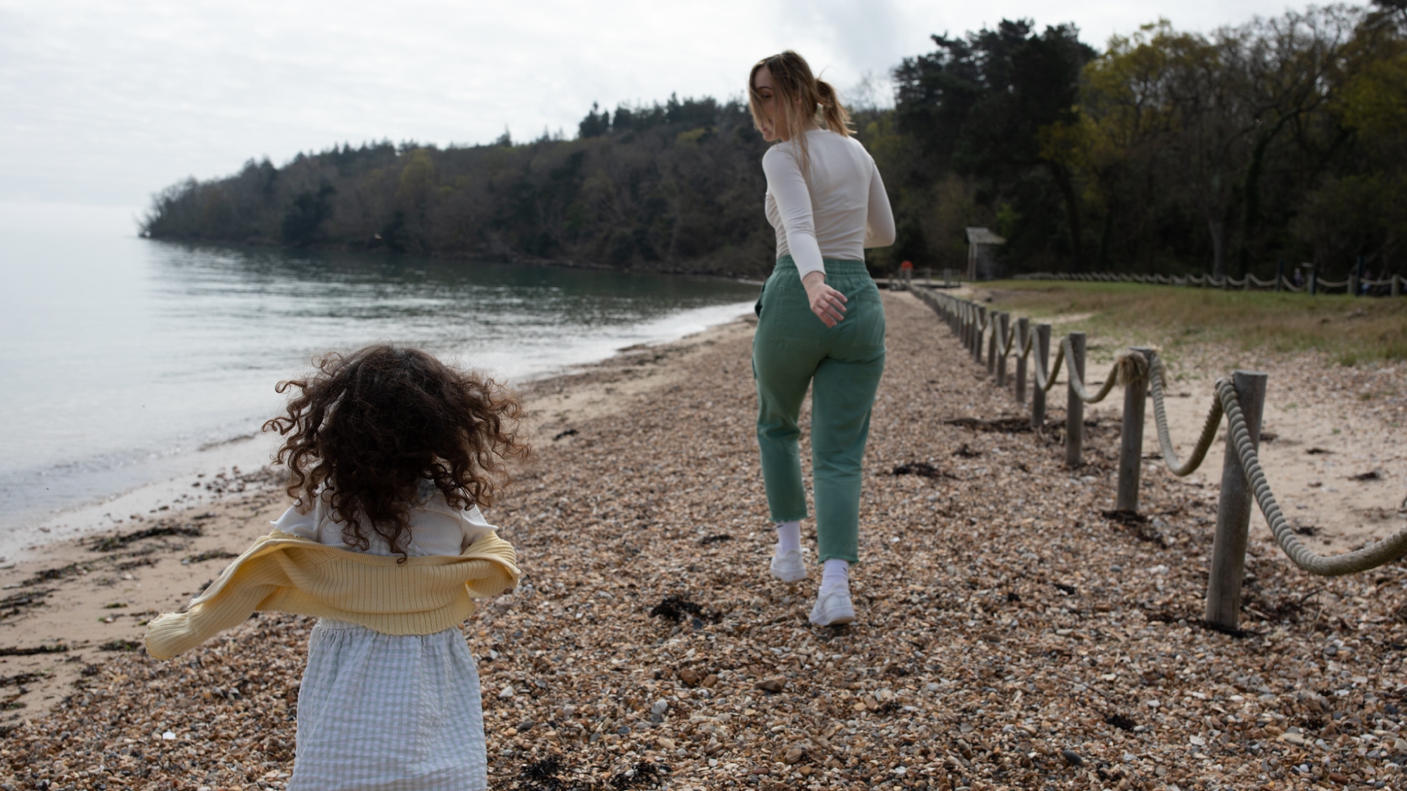 mum and daughter running along Osborne Bay