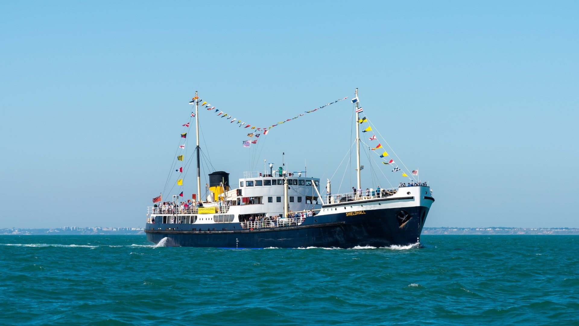 steamship shieldhall at sea with dress flags