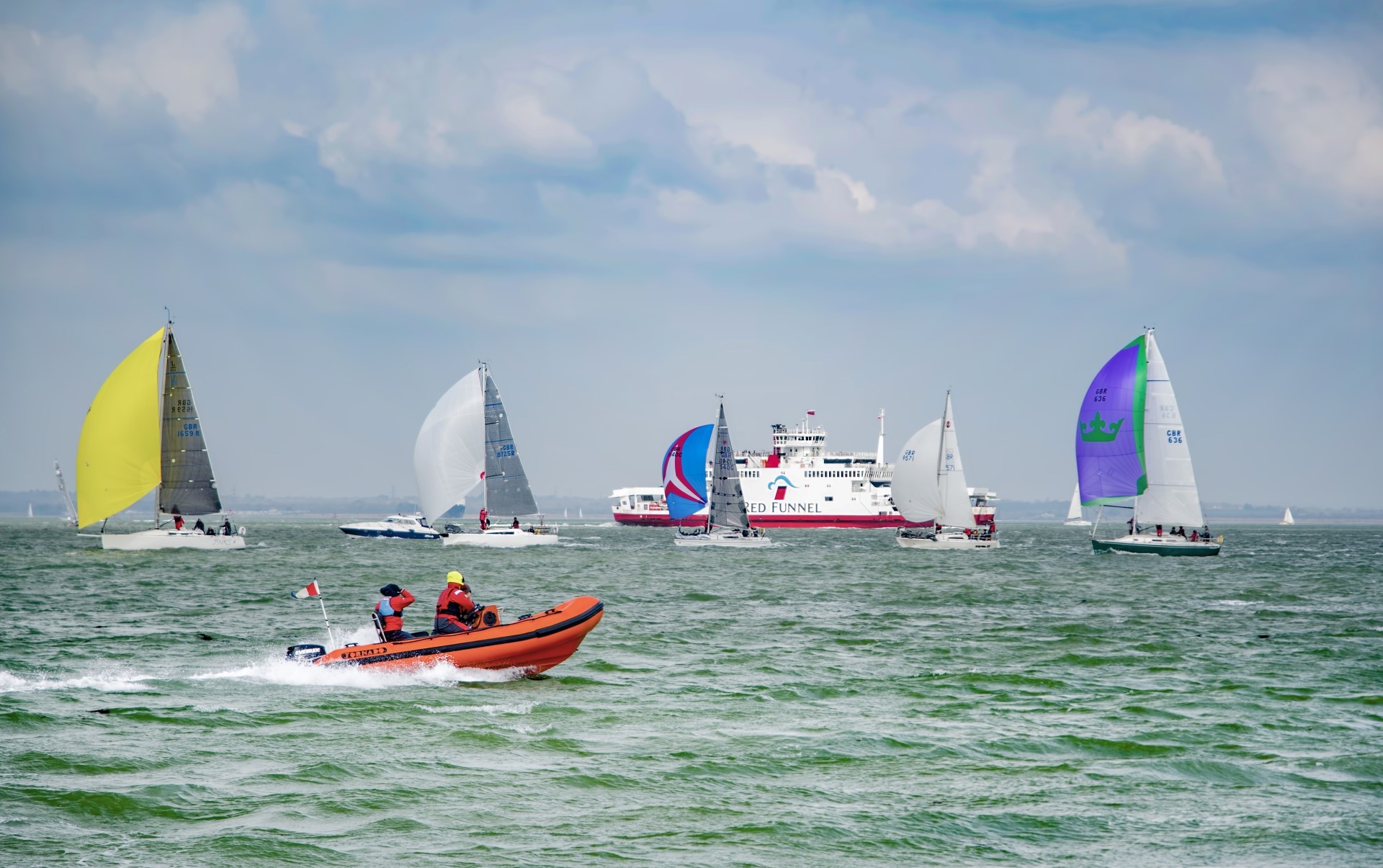 Cowes Week sailing with Red Funnel Ferry in background