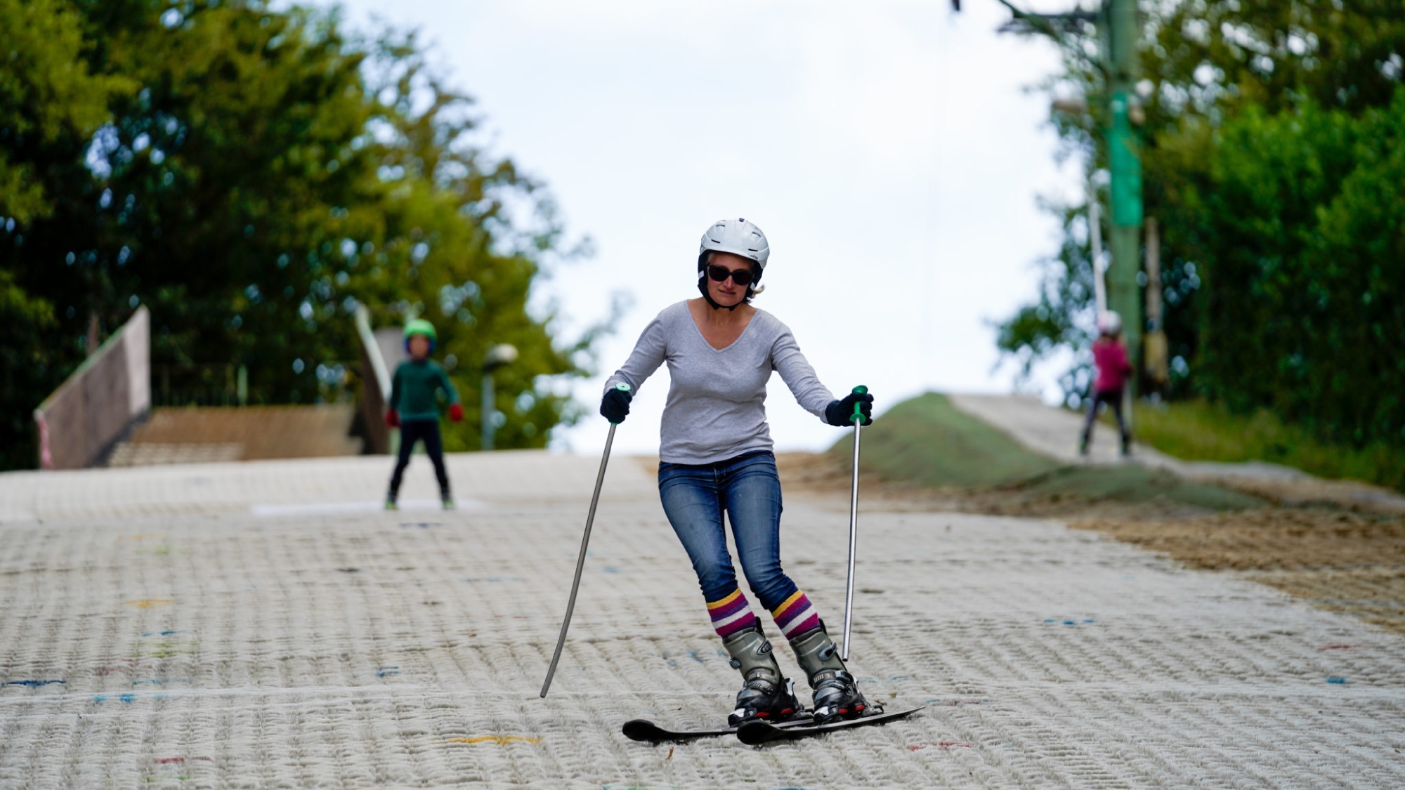 lady skiing down the dry slopes
