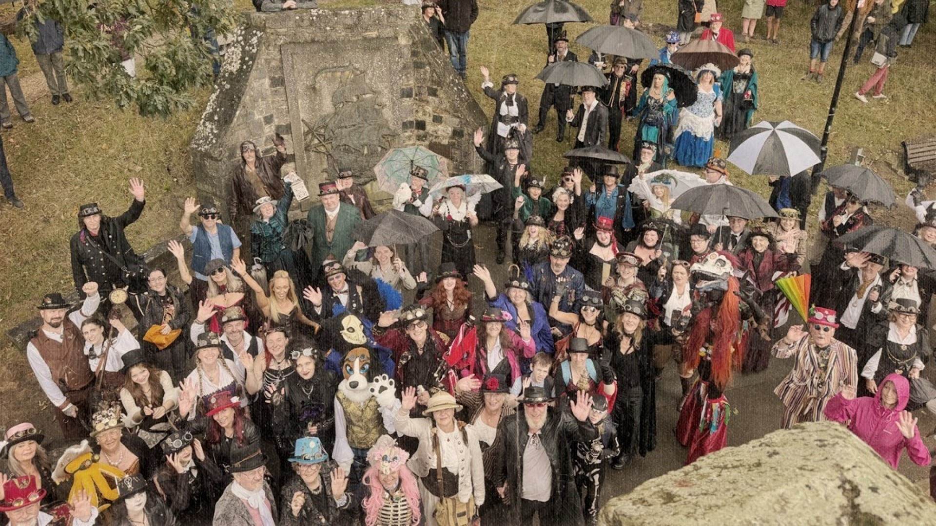 crowd of festivalgoers in steampunk attire such as corsets and top hats