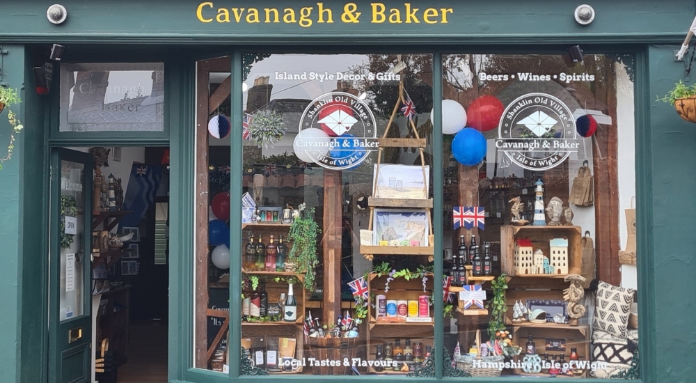 shop window containing food gifts and souvenirs such as mermaid gin