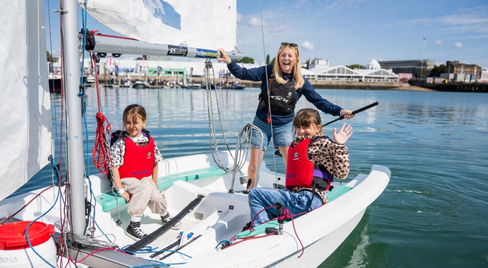 a woman and two kids on a boat 