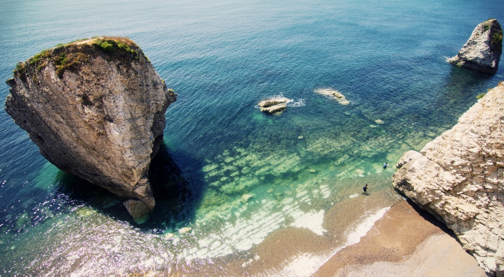aerial view of freshwater beach, rock stacks in the sea