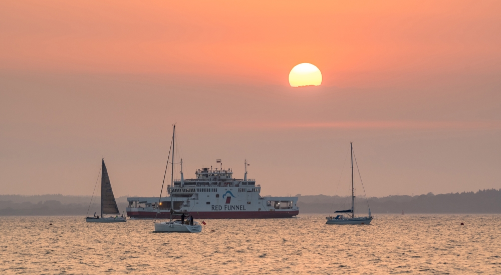 Image of the ferry on the water at dusk