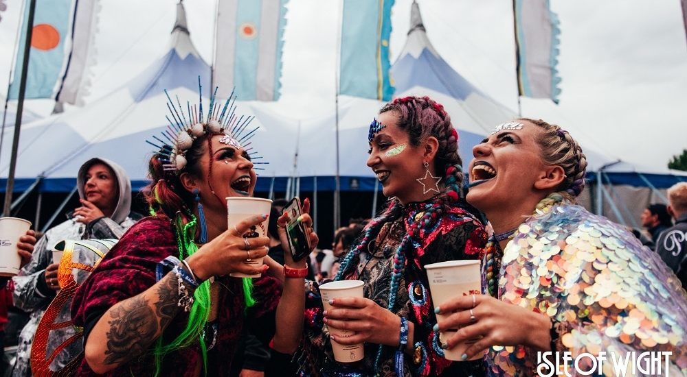 Group of people laughing with drinks