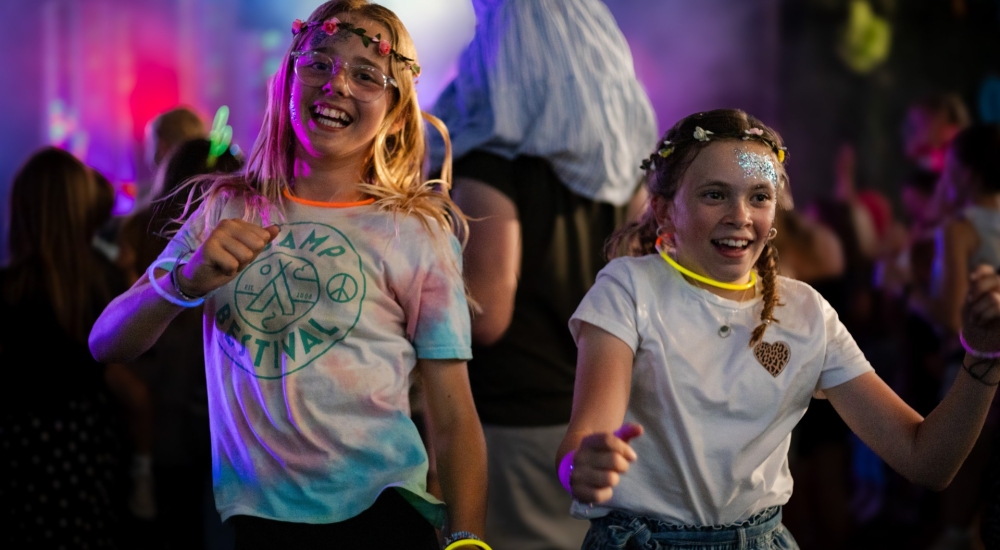 children dancing under disco lights