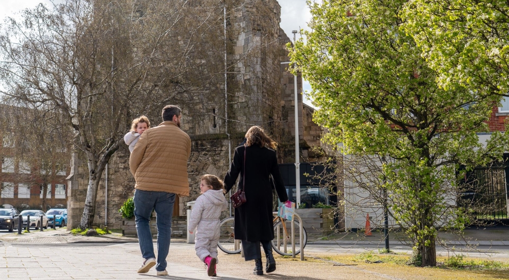 a family with two young children walking in southampton