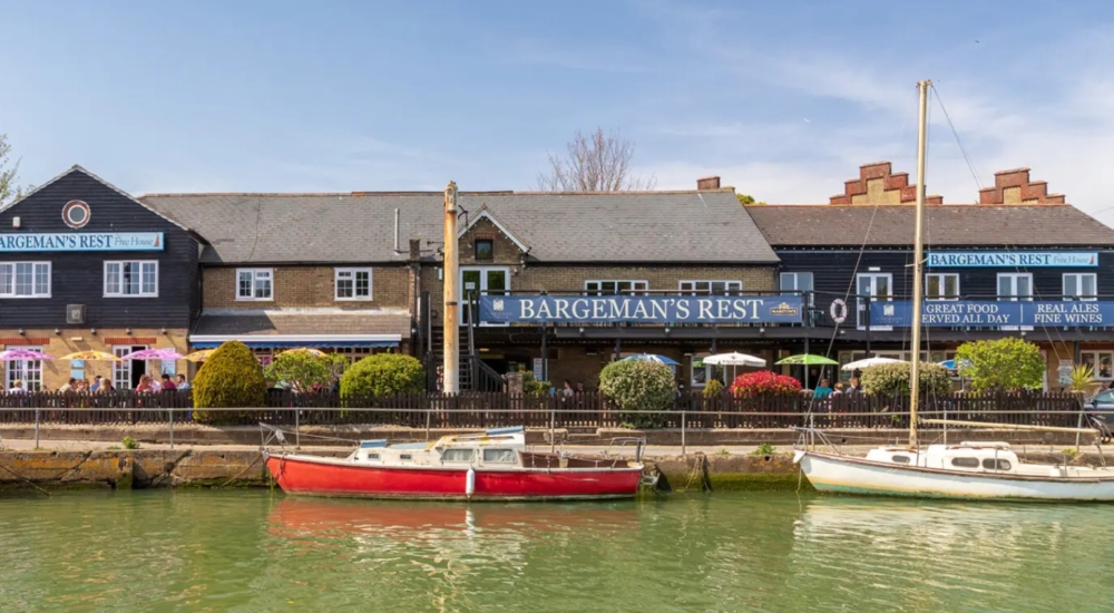 river with pub in background