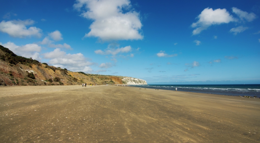 vast sandy beach and blue sky at yaverland